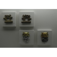 Gold pendants of cat predator and two elks